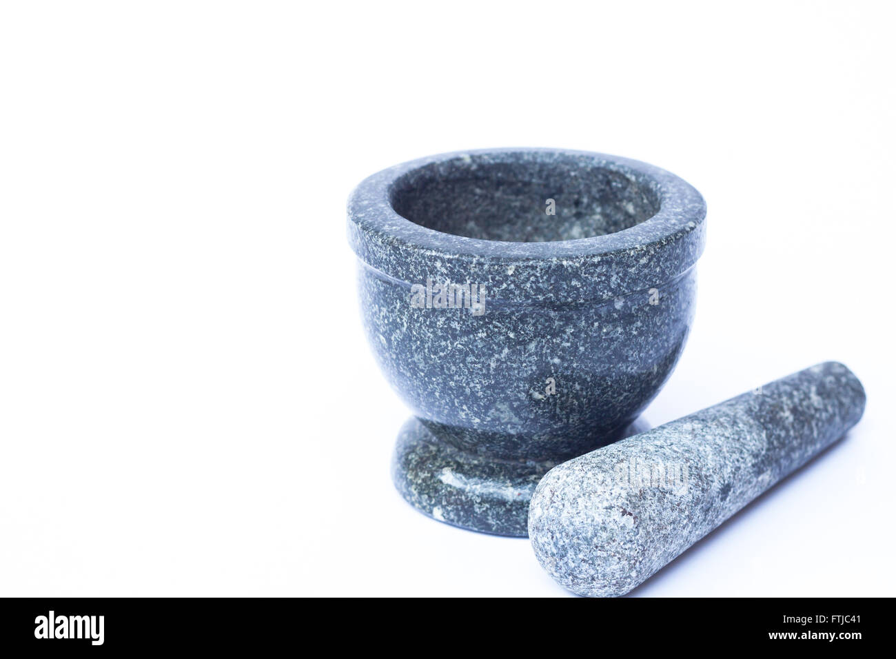 Mortier et pilon en pierre sur fond blanc, stock photo Banque D'Images