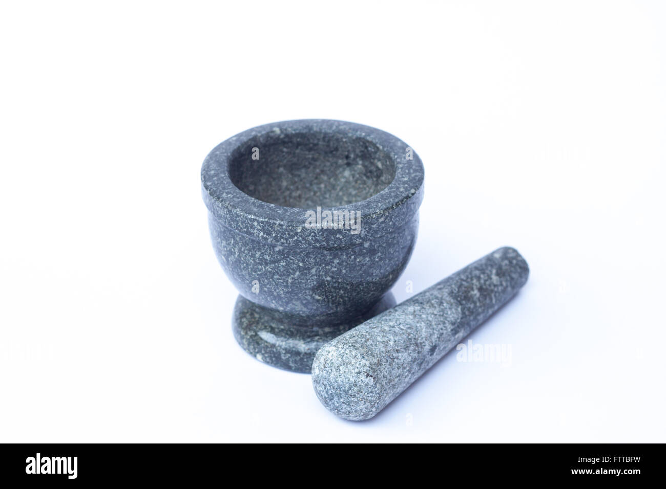 Mortier et pilon en pierre sur fond blanc, stock photo Banque D'Images