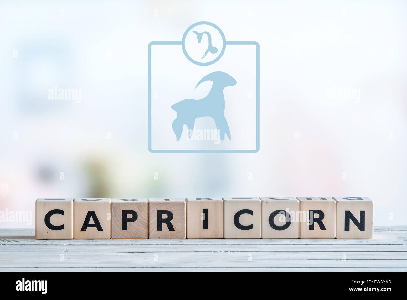 Capricorne signe du zodiaque sur une table en bois Banque D'Images
