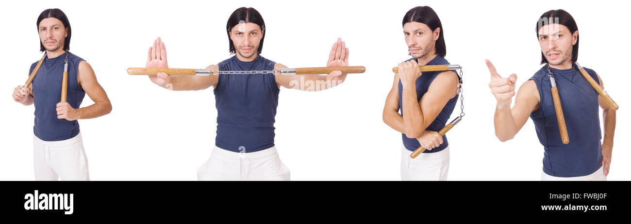Funny karate fighter avec nunchucks on white Banque D'Images