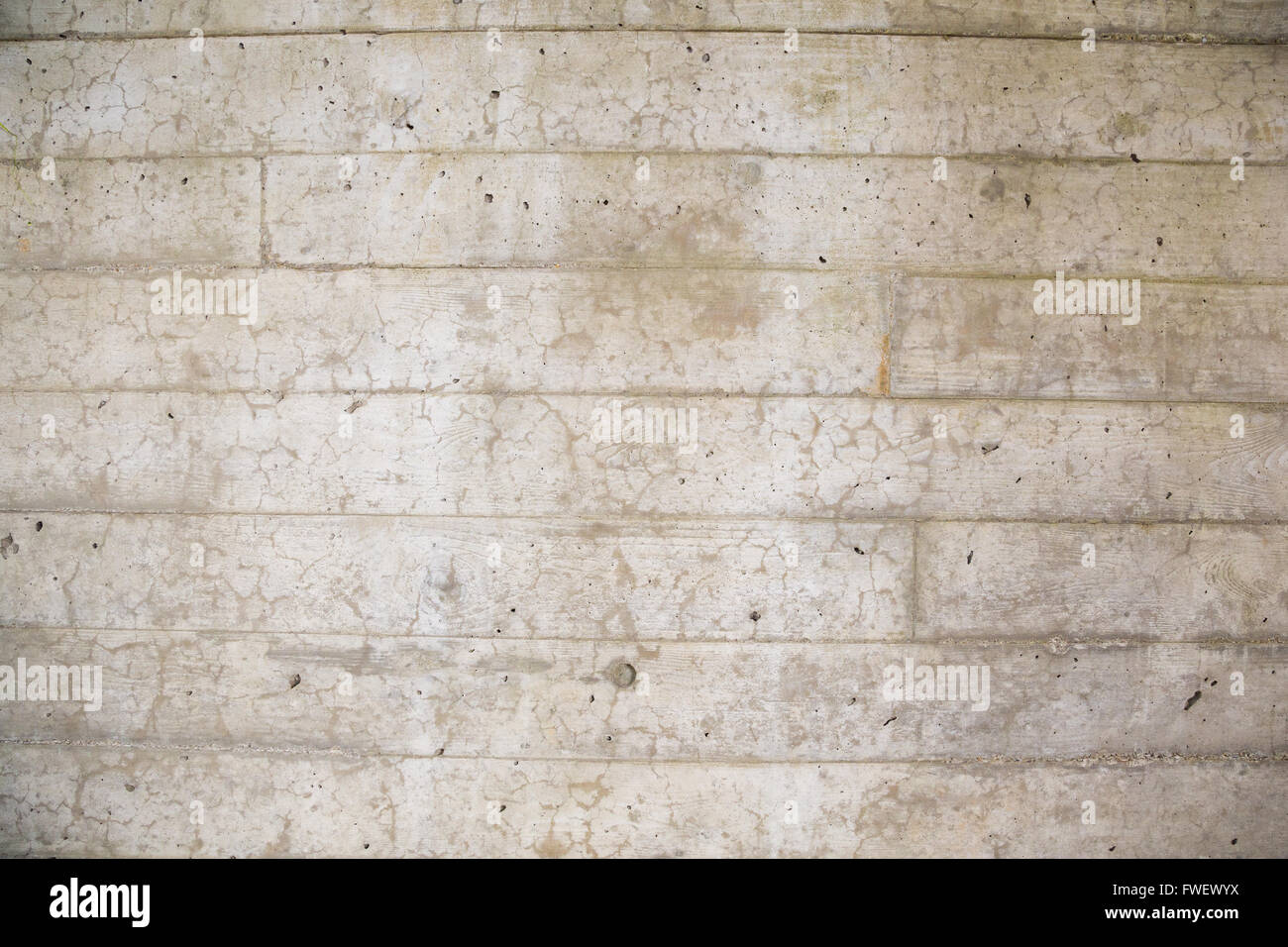 Un mur de ciment est photographié avec un objectif grand angle pour créer cette image de texture de fond du béton. Banque D'Images