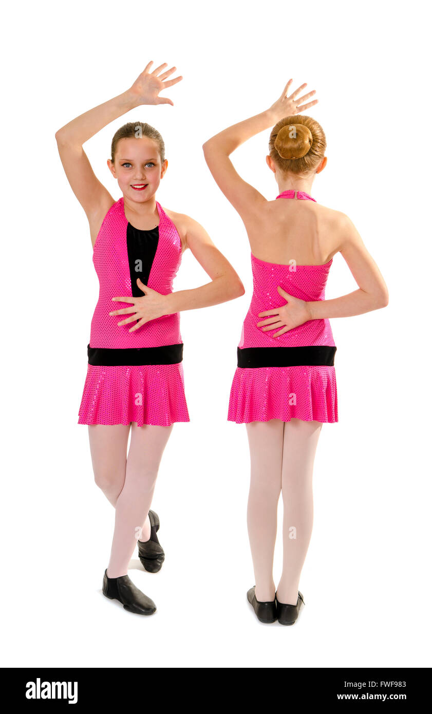 Deux filles préadolescentes en costume rose posant dans le style de danse Jazz Duo Banque D'Images