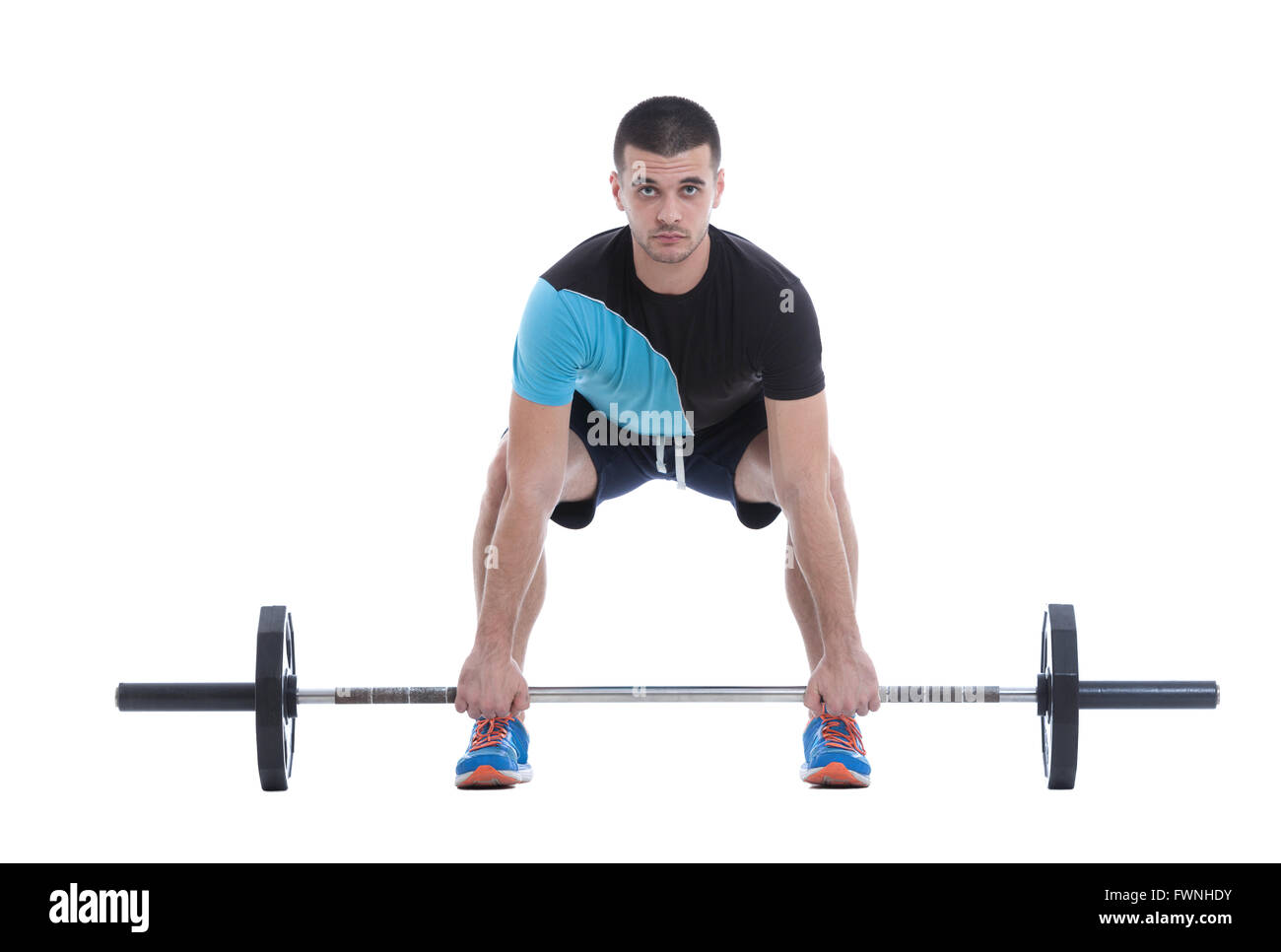 Athletic trainer pour se préparer à un exercice avec le barebell olympique. Droit isolé sur fond blanc. Banque D'Images