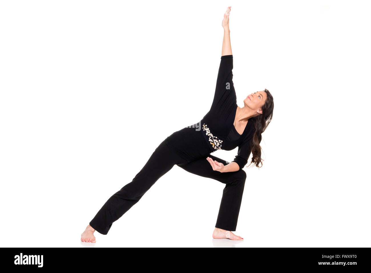 Femme d'âge moyen de faire du sport in front of white background Banque D'Images