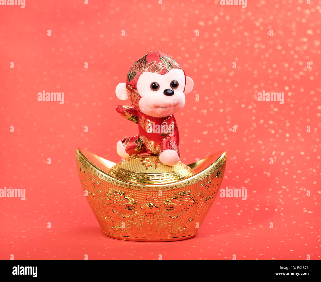 Nouvel an chinois jouet ornements de singe sur fond de fête Banque D'Images