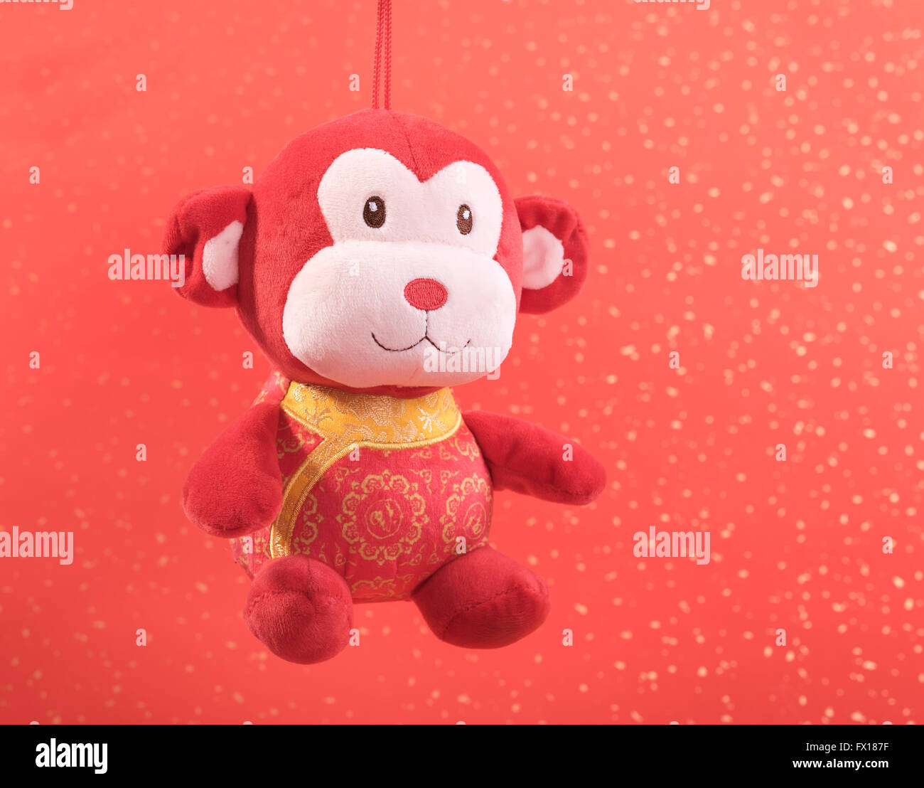 Nouvel an chinois jouet ornements de singe sur fond de fête Banque D'Images