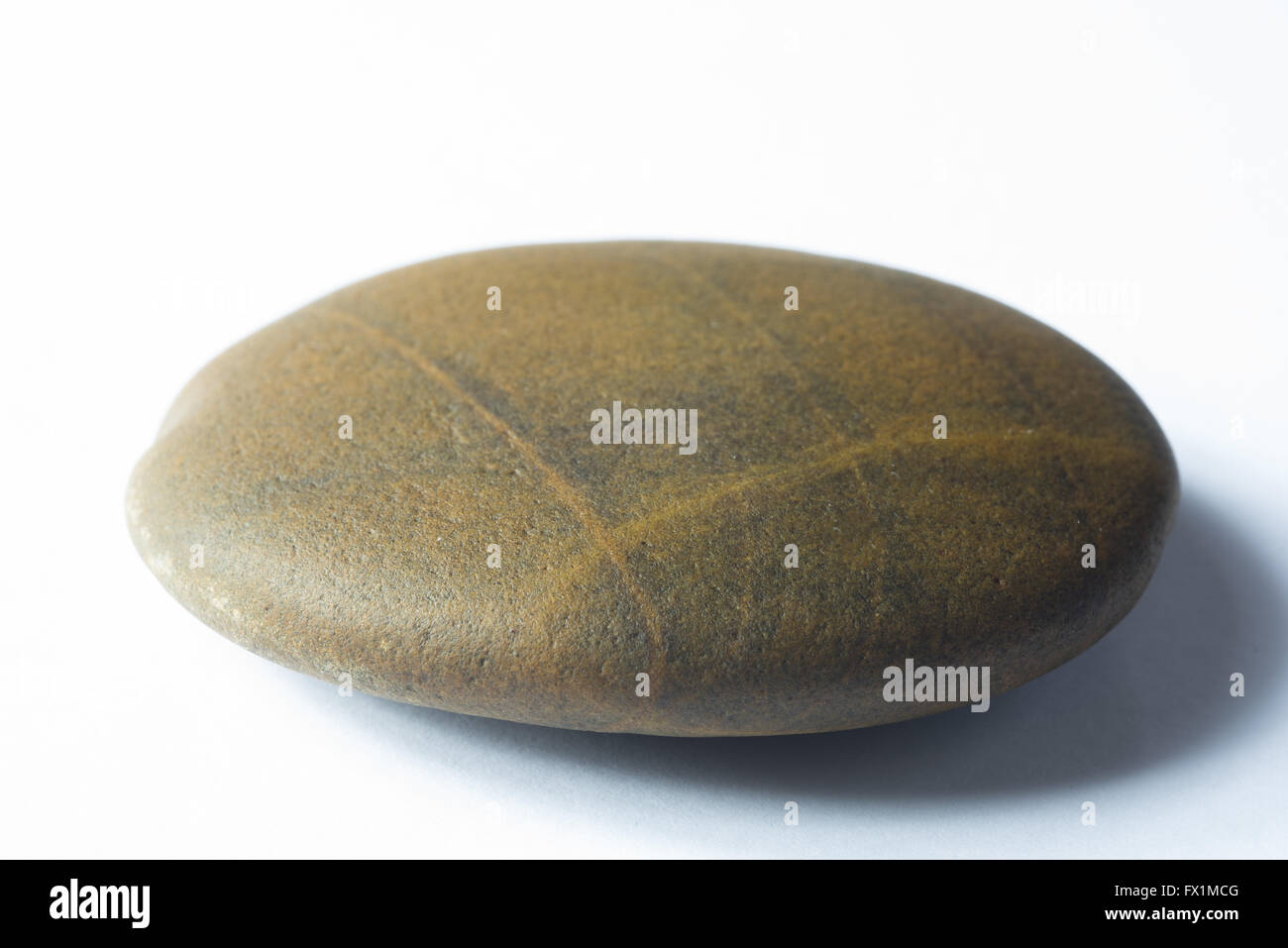 Close up of Zen Stone sur fond blanc Banque D'Images