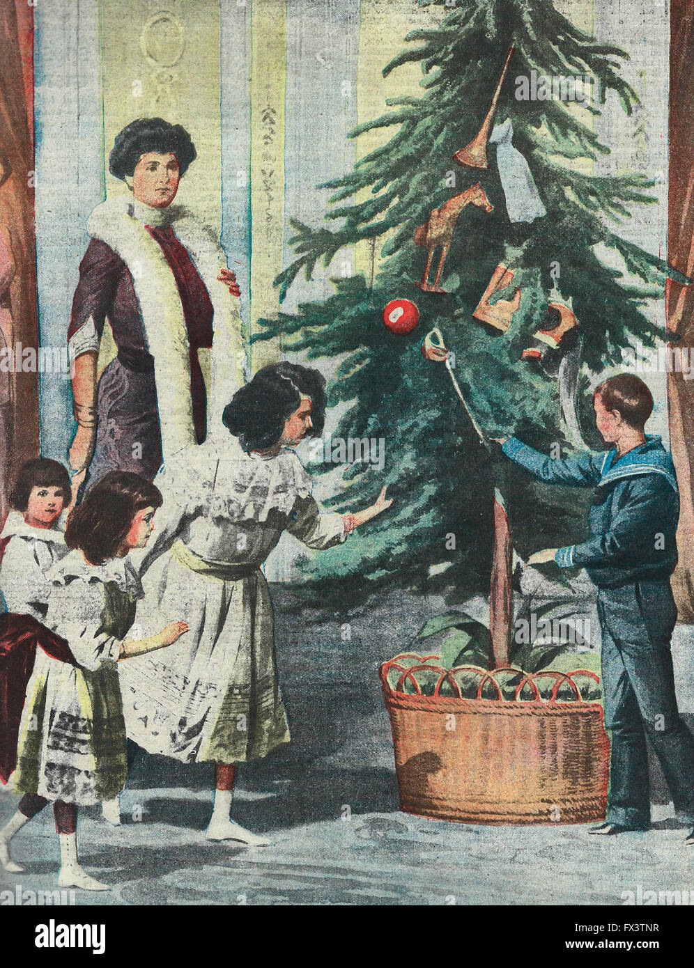 La Reine et les Princes de l'Italie autour de l'arbre de Noël classique, dans le Palais du Quirinal 1913 Banque D'Images
