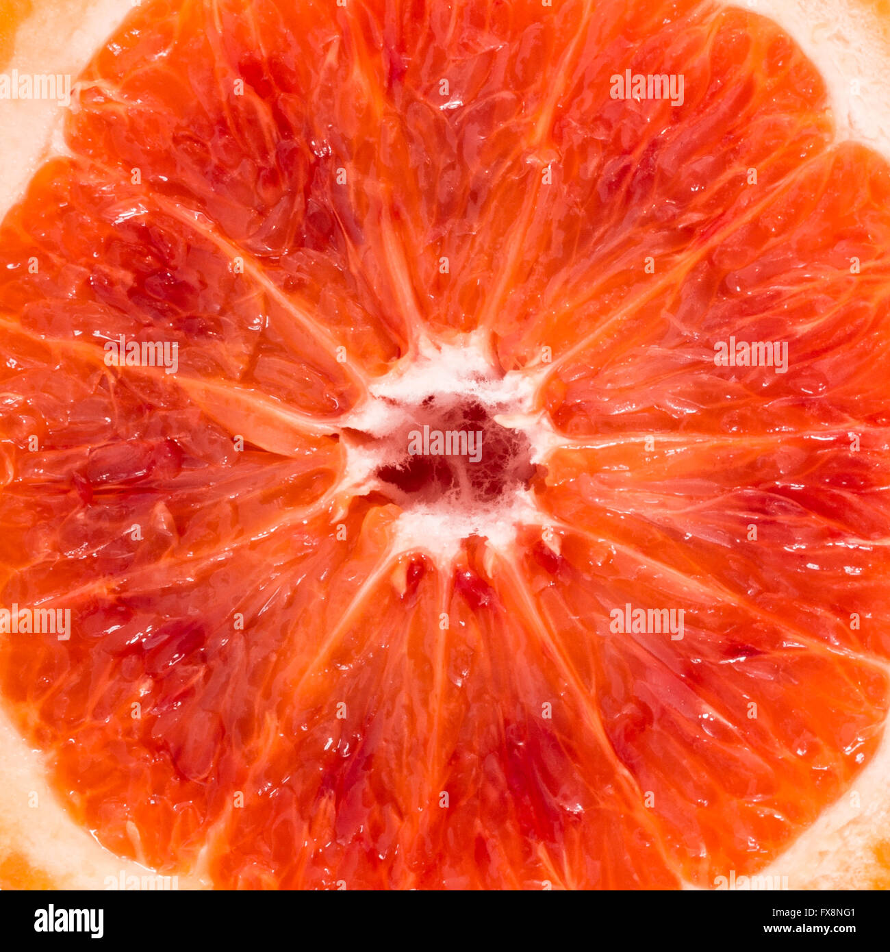 Close-up of red blood orange de Sicile, de l'alimentation arrière-plan. Banque D'Images