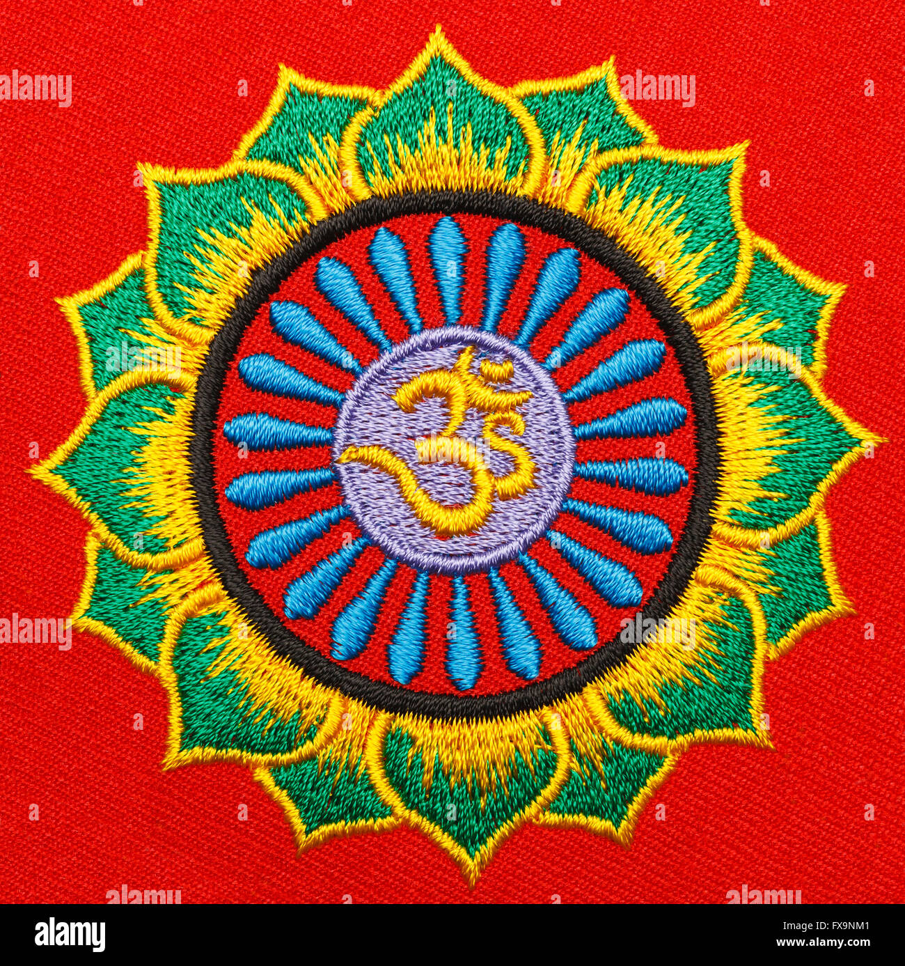Symbole Om en fleur de lys avec éclatement d'étoile. Banque D'Images