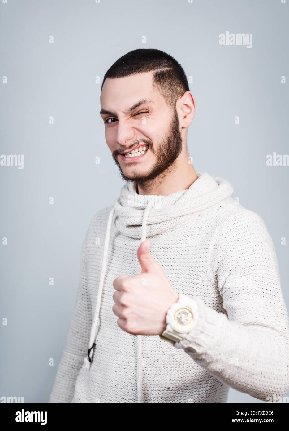 Young handsome man with Thumbs up Banque D'Images