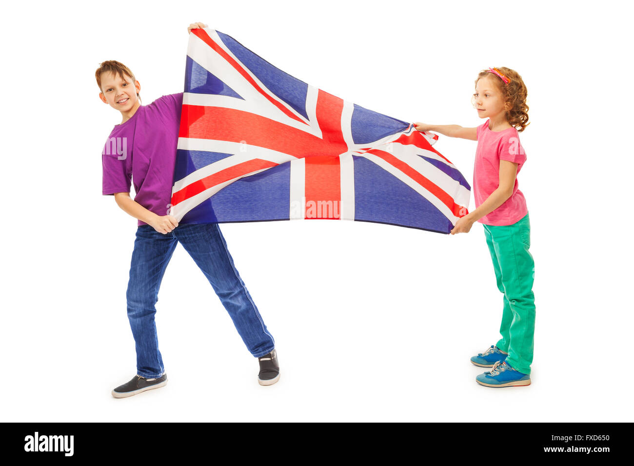 Deux enfants, garçon et fille agitant drapeau anglais Banque D'Images