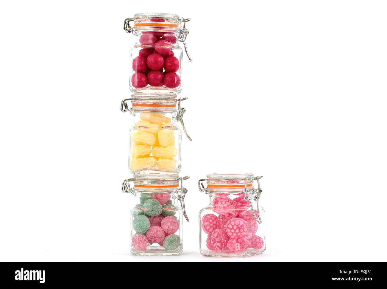 Quatre bols remplis de bonbons colorés Banque D'Images