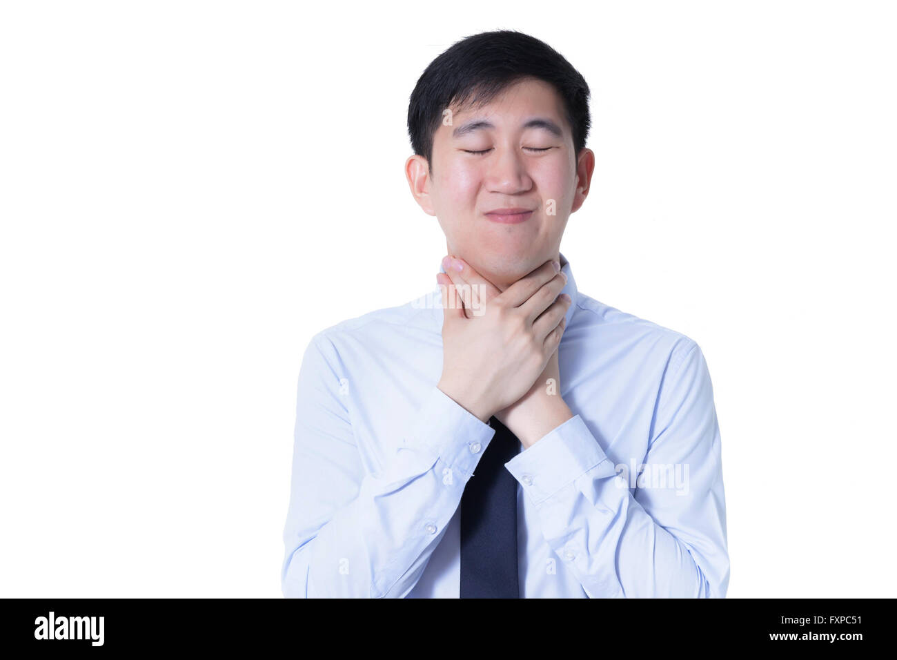 Jeune homme asiatique ayant mal de gorge / maladies liées à la gorge Banque D'Images