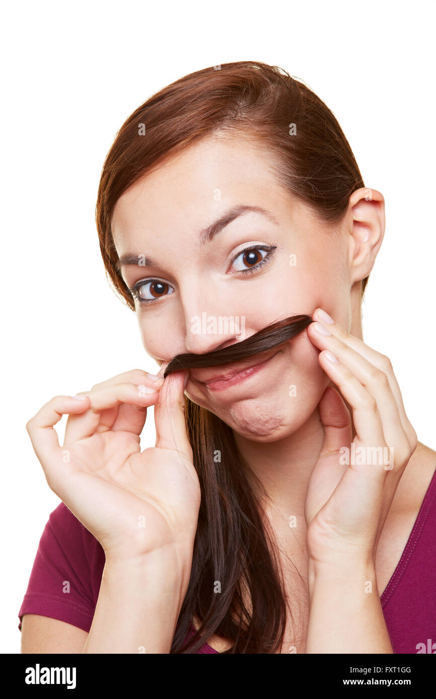 Jeune femme à l'aide d'un sèche streak comme un fake moustache Banque D'Images