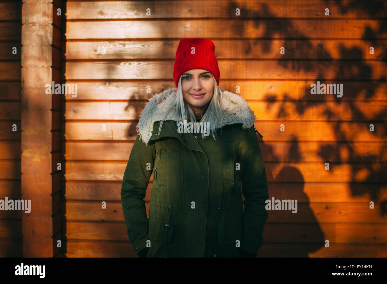 Young Beautiful woman standing against wall Banque D'Images