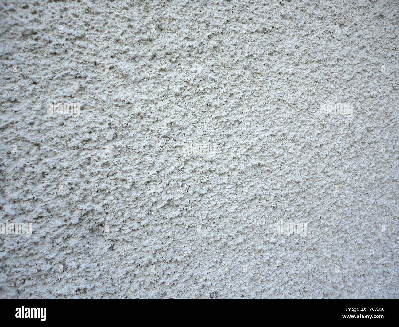 Motif stuc blanc sur le mur faisant une texture intéressante Banque D'Images