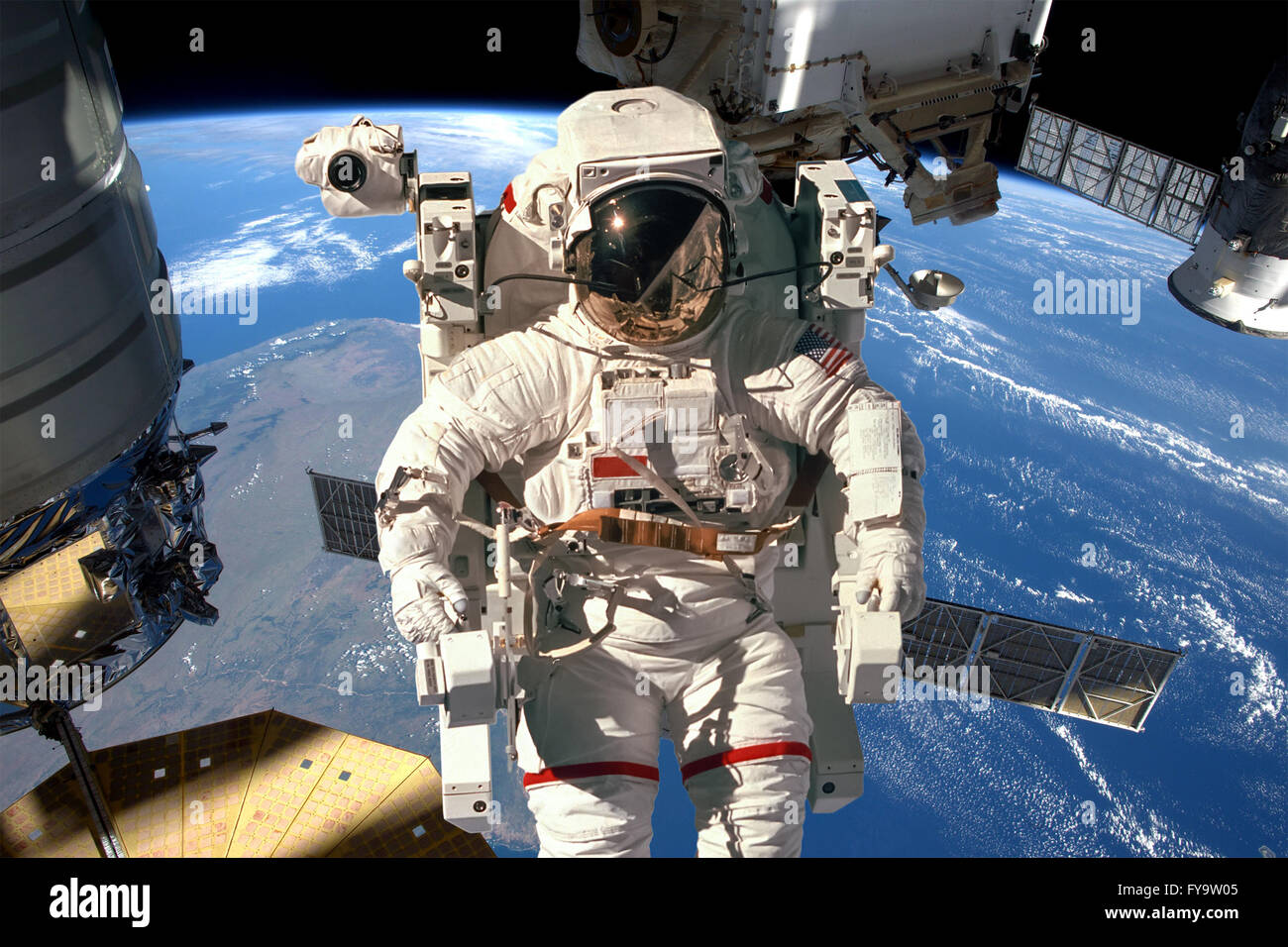 Station spatiale internationale et astronaute dans l'espace au cours de la planète Terre. Éléments de cette image fournie par la NASA. Banque D'Images