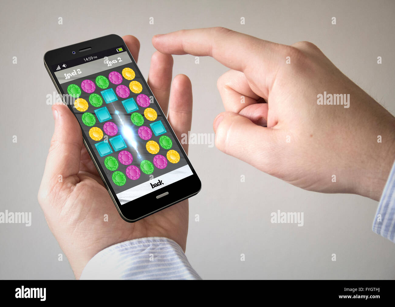 Close up of man en utilisant 3D généré téléphone intelligent avec jeu de puzzle  sur l'écran. Écran graphique sont constitués Photo Stock - Alamy