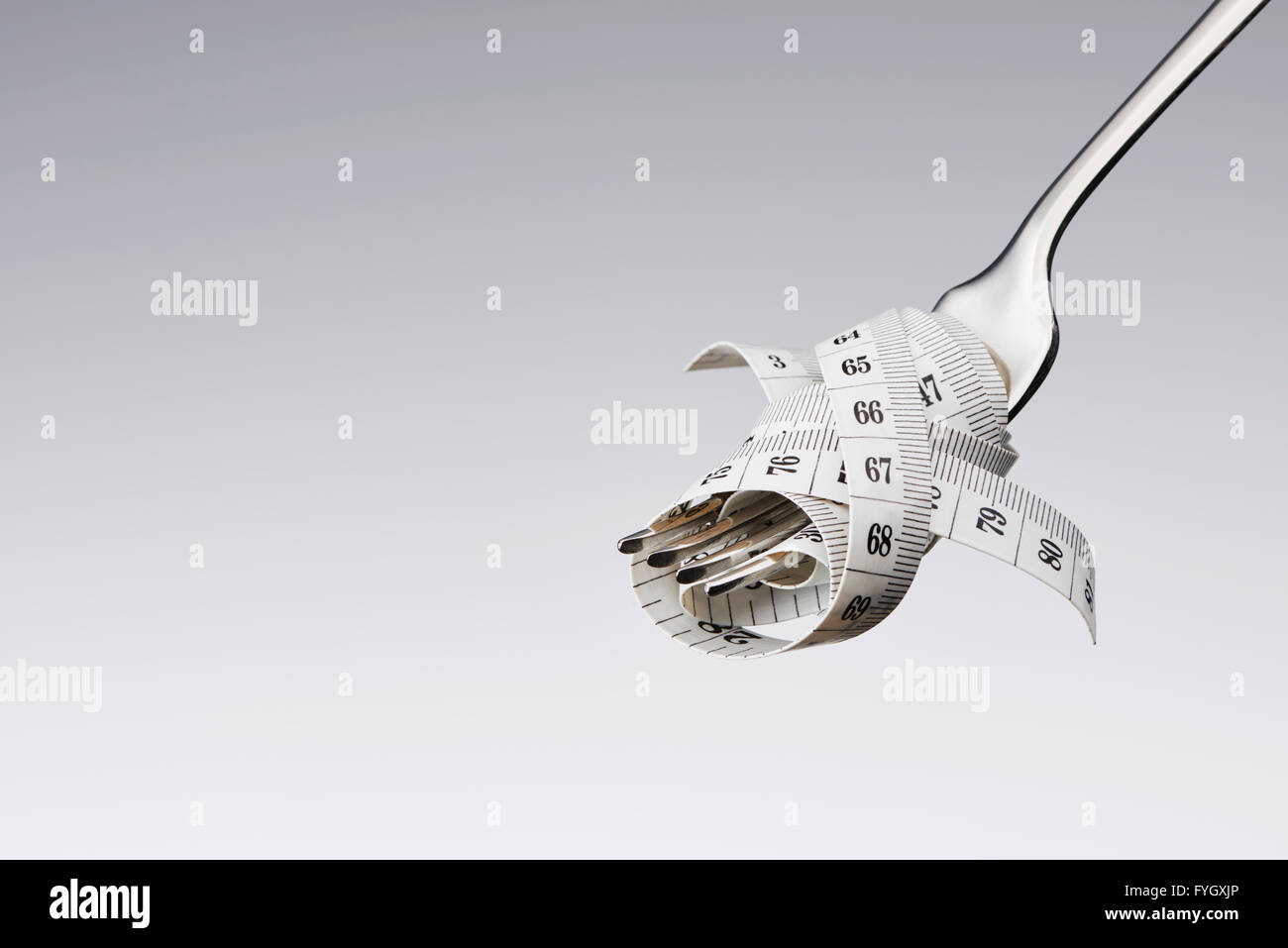 Fourche avec ruban de mesure, les régimes Obésité Concept Banque D'Images