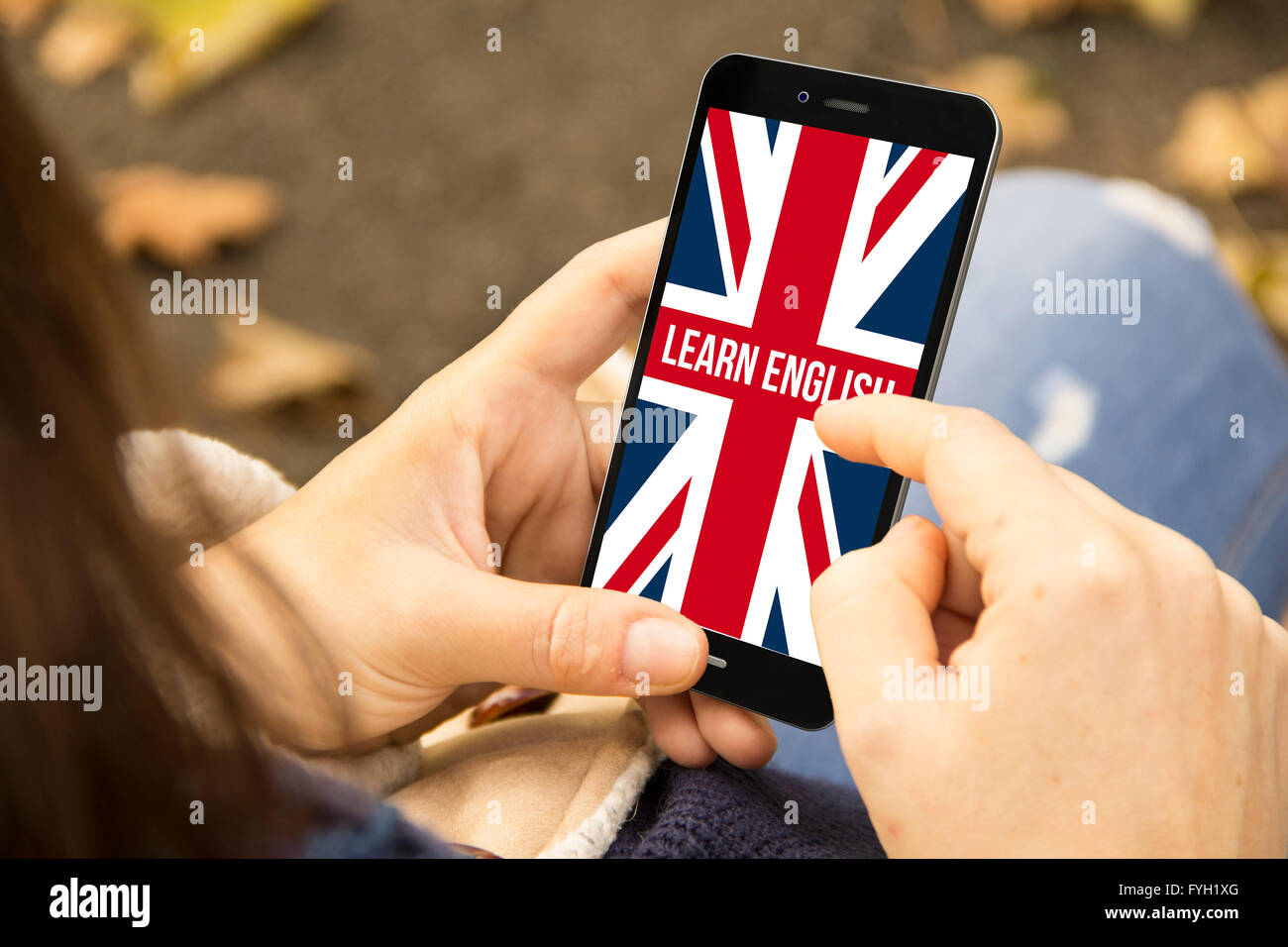 Concept d'apprentissage des langues : un smartphone 3D généré avec apprendre l'anglais sur l'écran. Graphiques à l'écran sont Banque D'Images