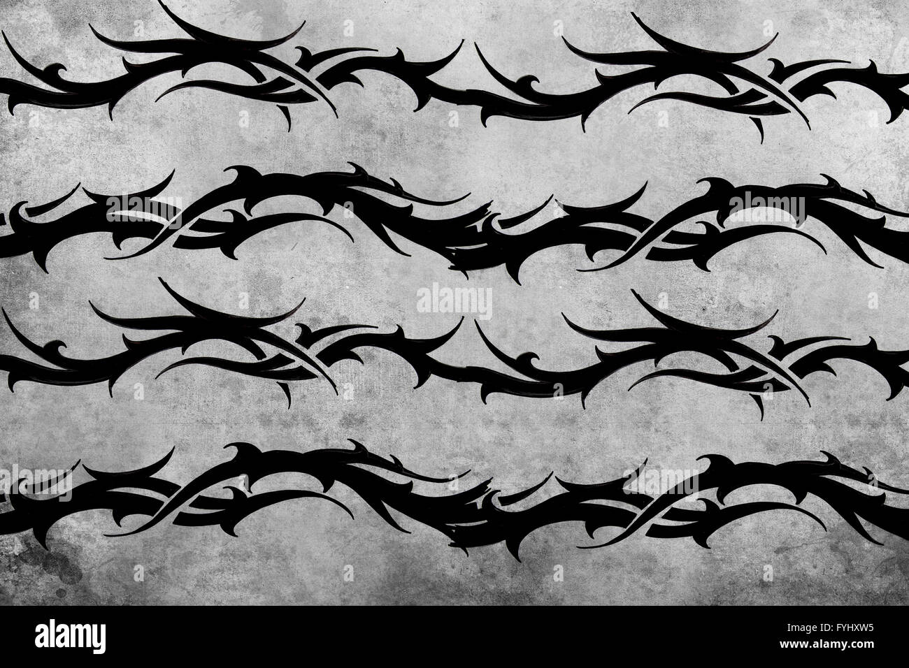 La conception du tatouage tribal sur fond gris. toile texturée. L'image artistique Banque D'Images