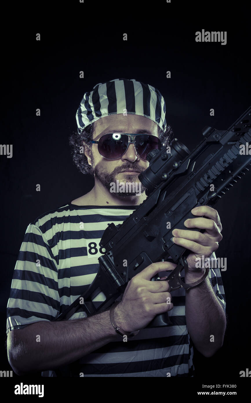 Émeute, prisonnier dans une prison avec une mitrailleuse Banque D'Images