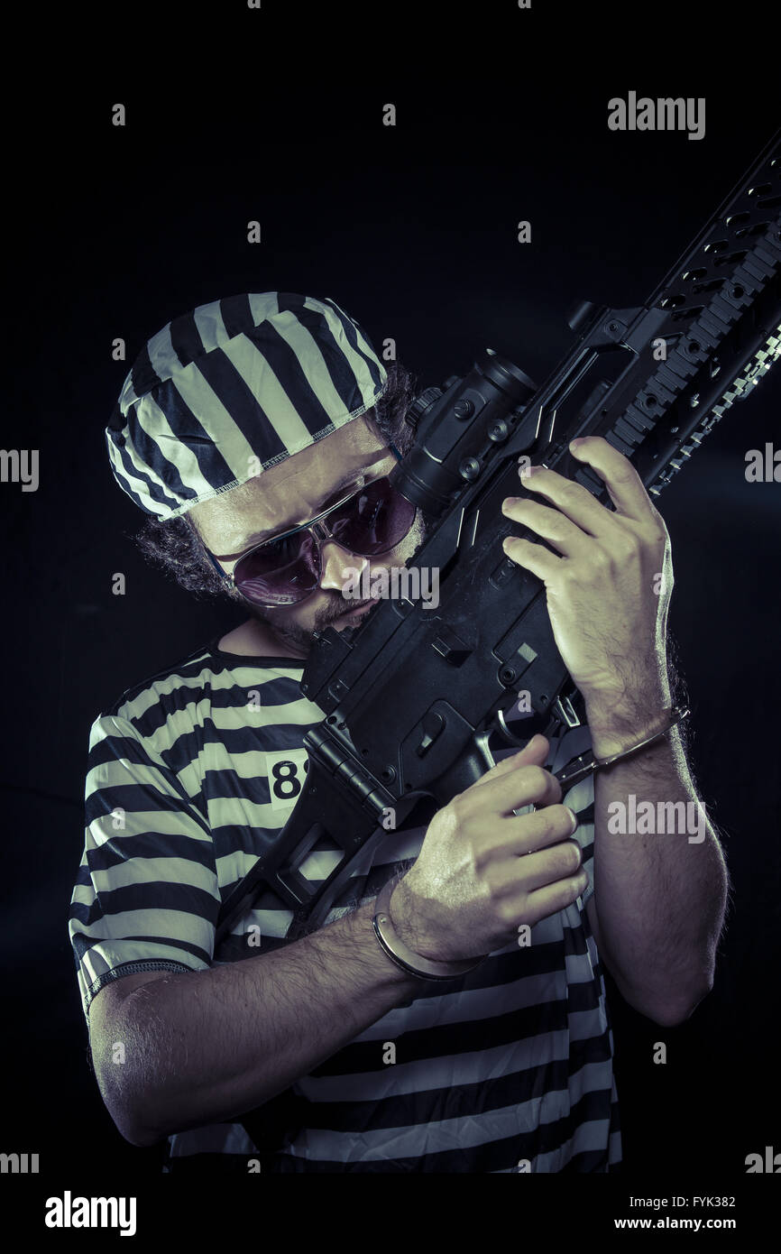 Émeute, prisonnier dans une prison avec une mitrailleuse Banque D'Images