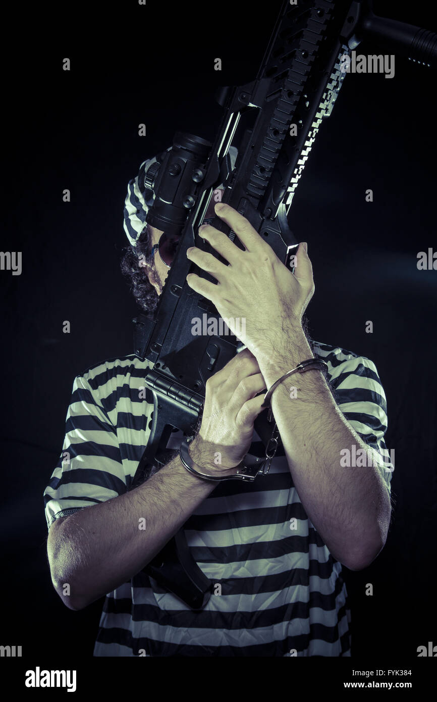 Émeute, prisonnier dans une prison avec une mitrailleuse Banque D'Images