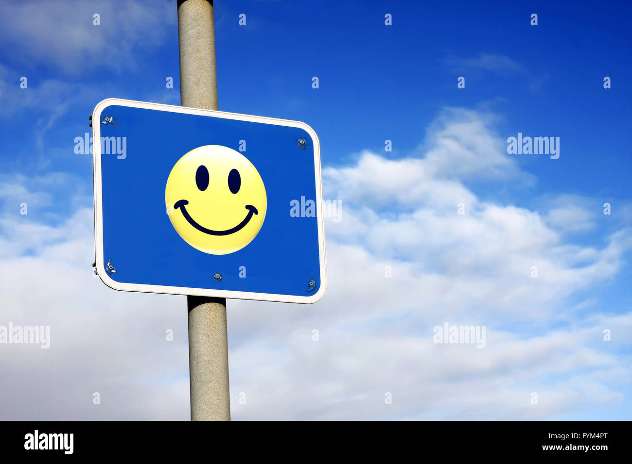 Smiley against a blue sky Banque D'Images