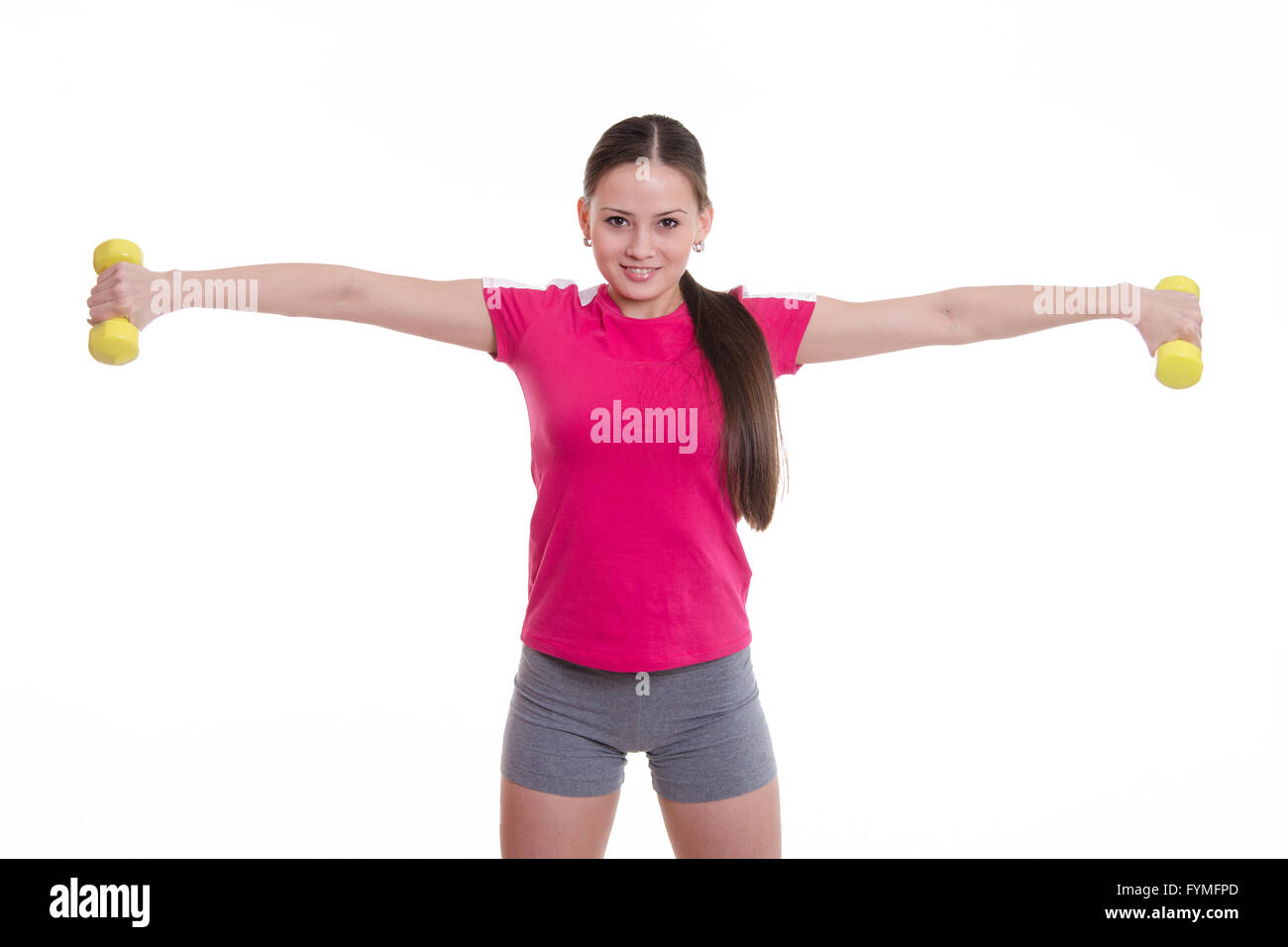 Les deux bras tendus Sportswoman with dumbbells Banque D'Images