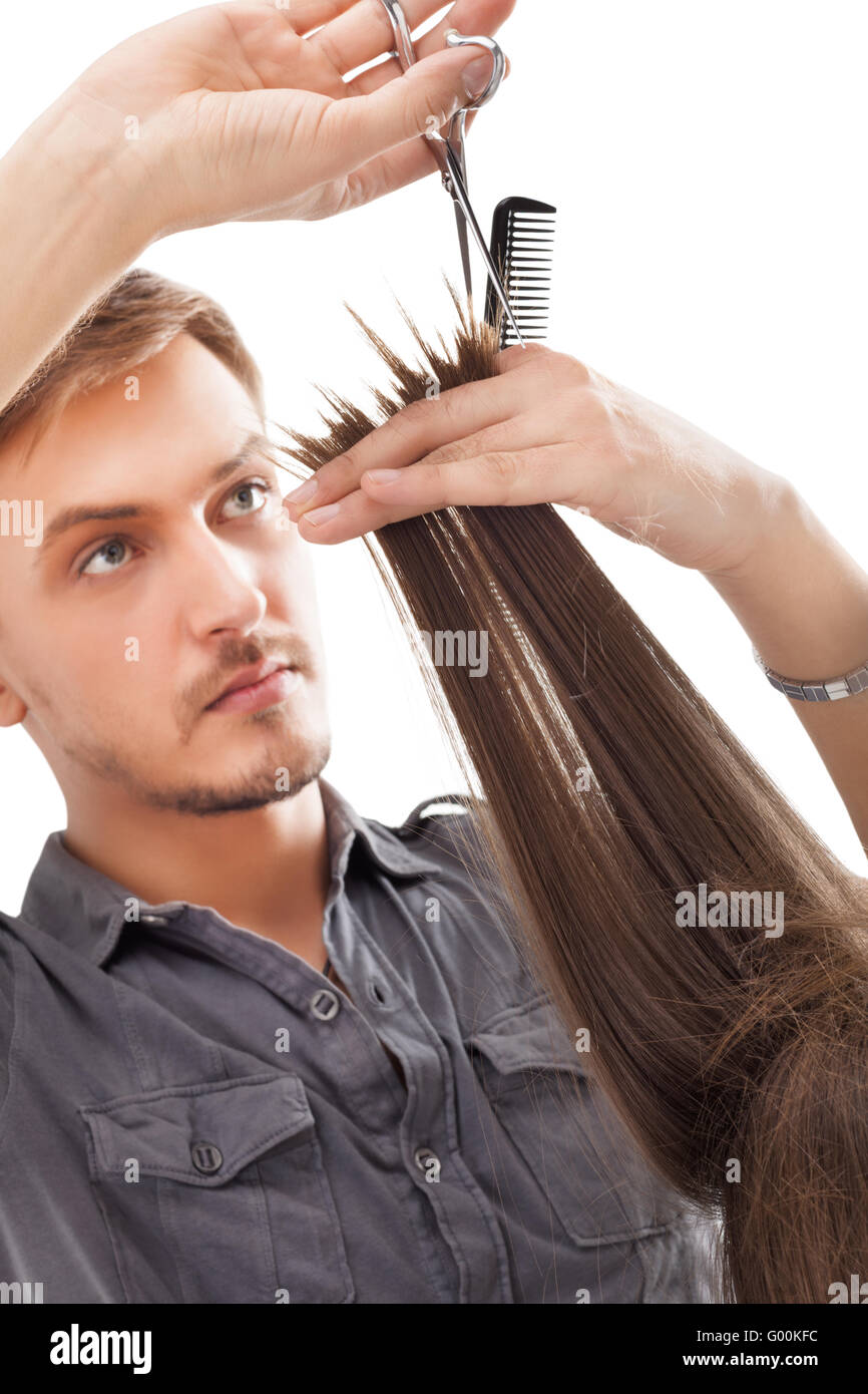 Coiffeur professionnel avec modèle de cheveux longs Banque D'Images