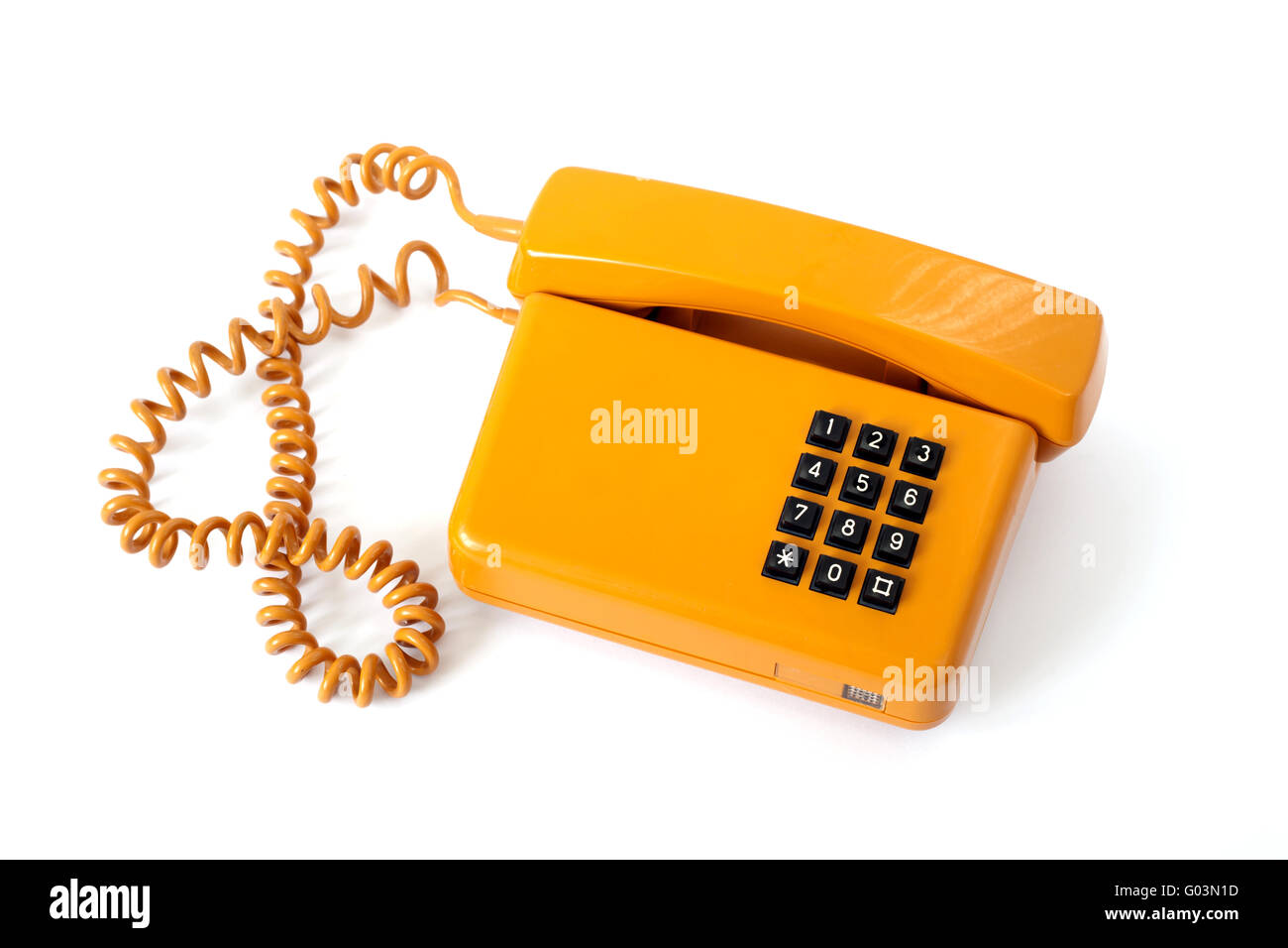 Vieux téléphone orange isolé sur fond blanc Banque D'Images