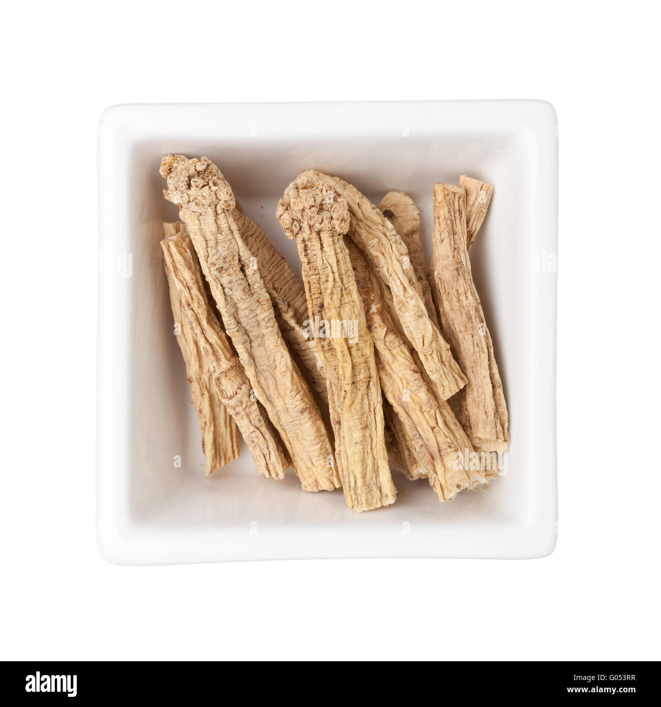 La médecine traditionnelle chinoise - Dangshen dans un bol carré isolé sur fond blanc Banque D'Images