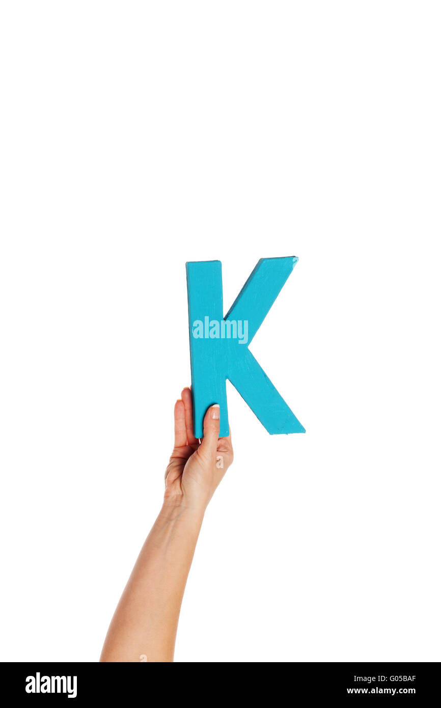 Main tenant la lettre K du bas Banque D'Images Main tenant la lettre K du bas Banque D'Images
