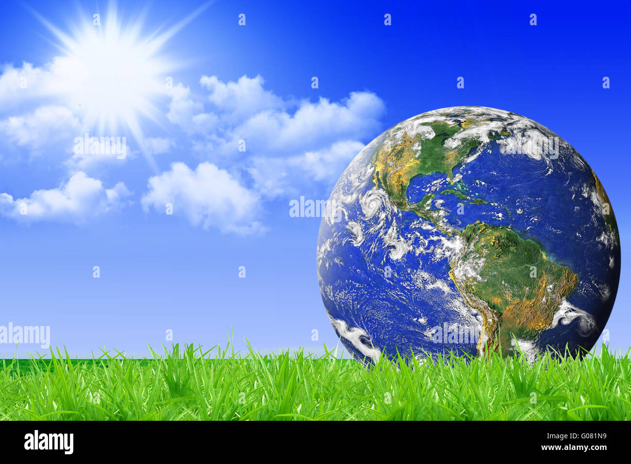 La Terre planète bleue sur l'herbe verte et ciel bleu retour Banque D'Images