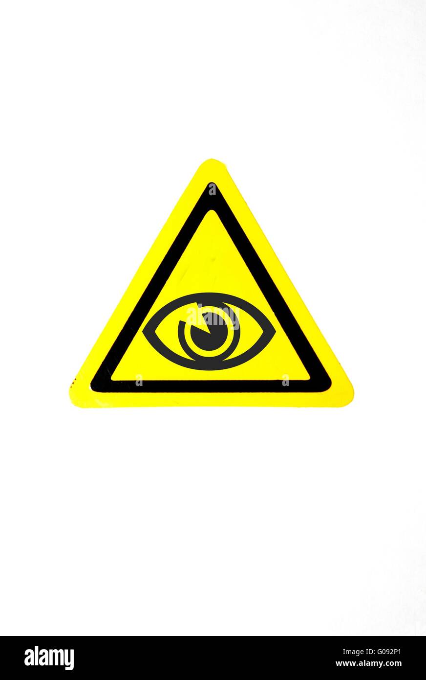 Eye sur un triangle jaune Banque D'Images