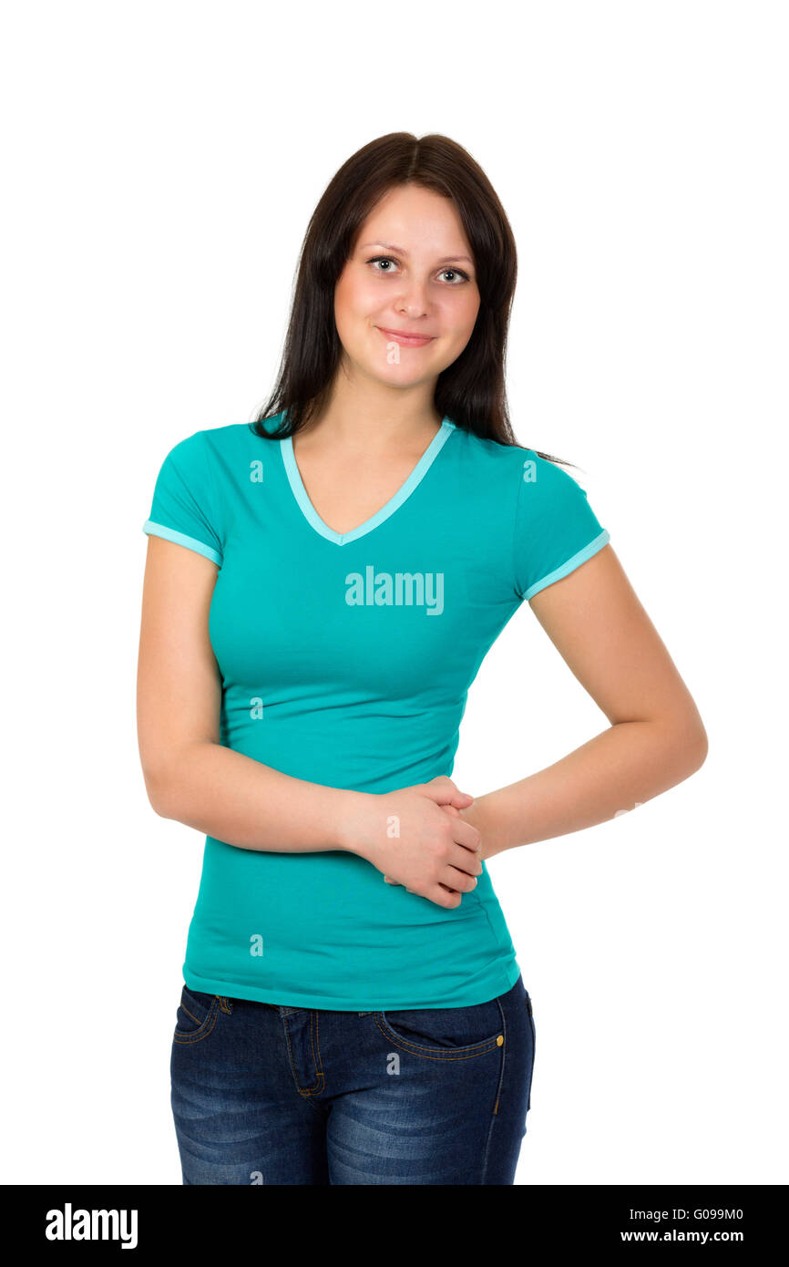 Jeune femme en t-shirt vert et bleu jeans posing over white Banque D'Images