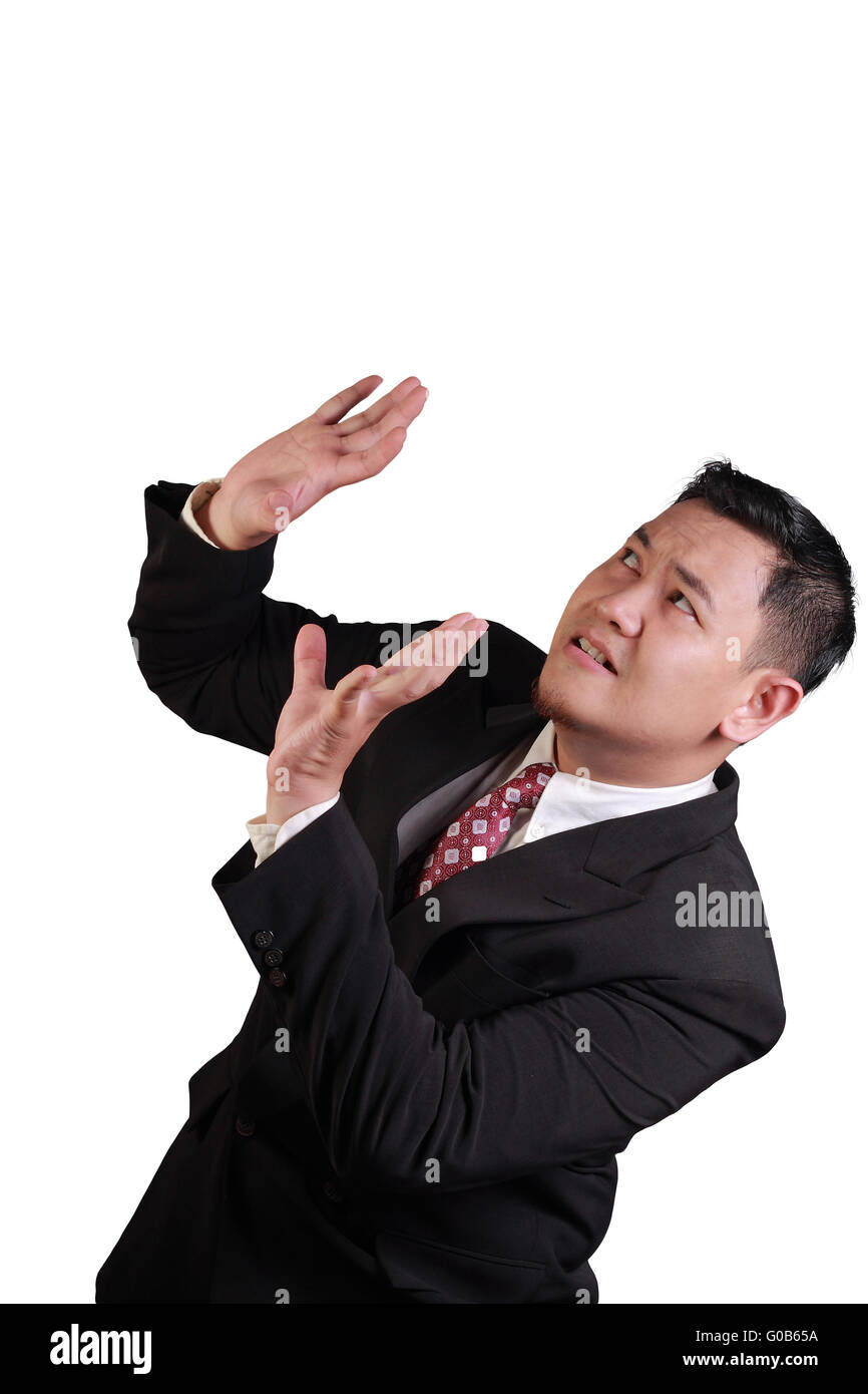 Concept d'image d'un Asian businessman holding on sous la pression d'en haut isolated on white Banque D'Images