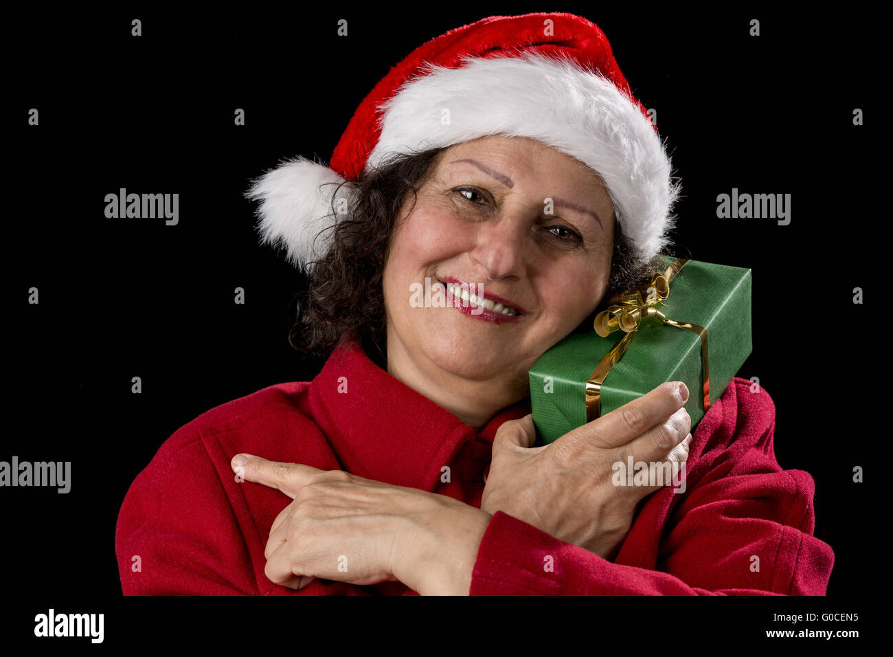 Senior Femme avec capuchon rouge Père Noël Banque D'Images