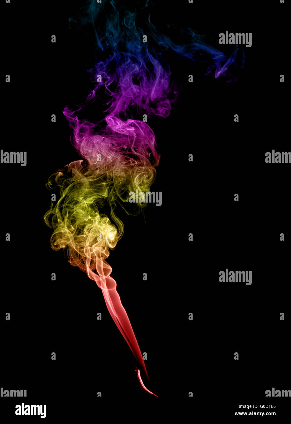 Résumé La fumée multicolore sur fond sombre Banque D'Images
