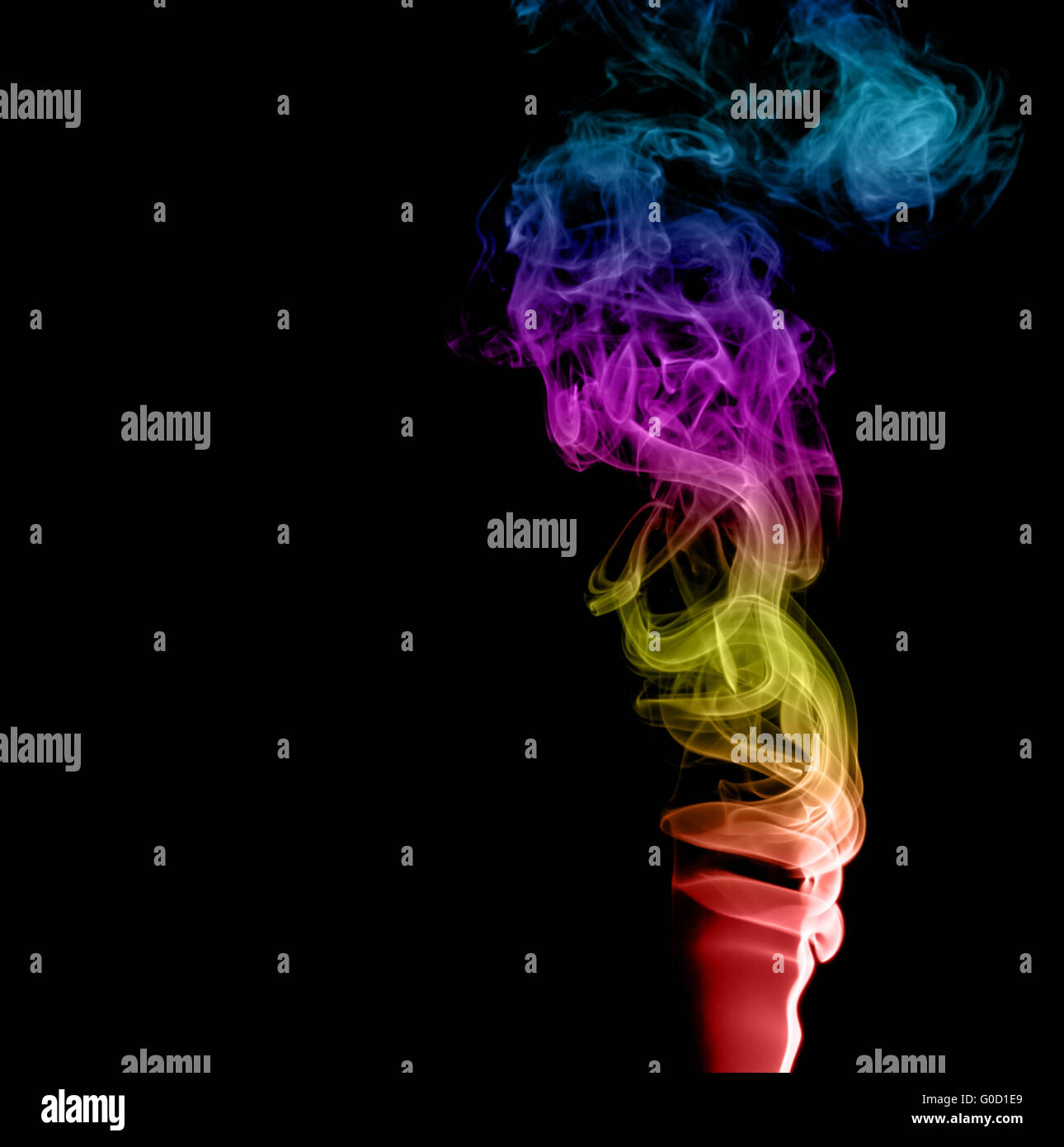 Résumé La fumée multicolore sur fond sombre Banque D'Images