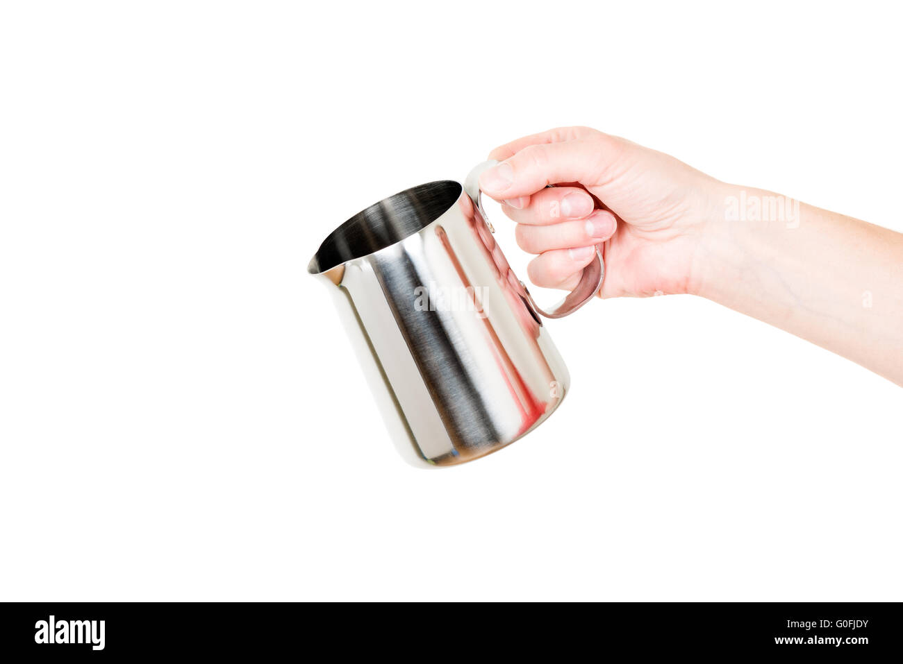 Chaudière en acier inoxydable pot de lait dans la main isolated on white Banque D'Images