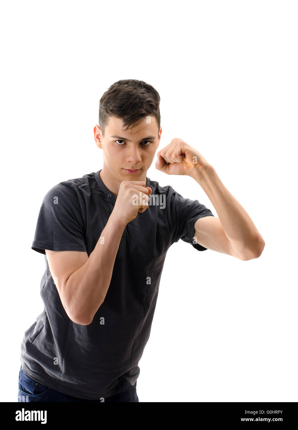 Homme adolescent en position pour la boxe isolated on white Banque D'Images