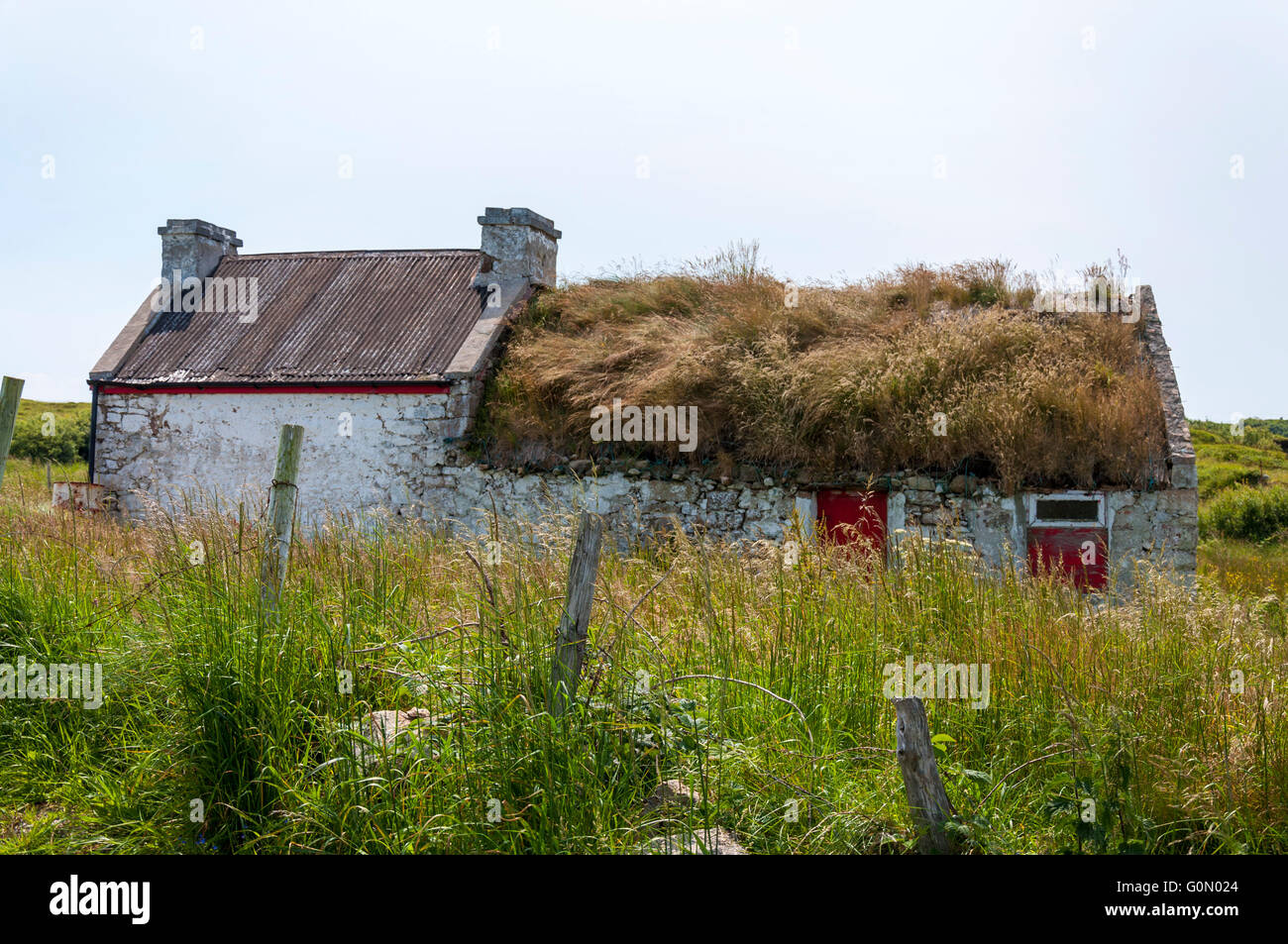 Envahi par la chaumière de jardin, Burtonport, comté de Donegal, Irlande Banque D'Images