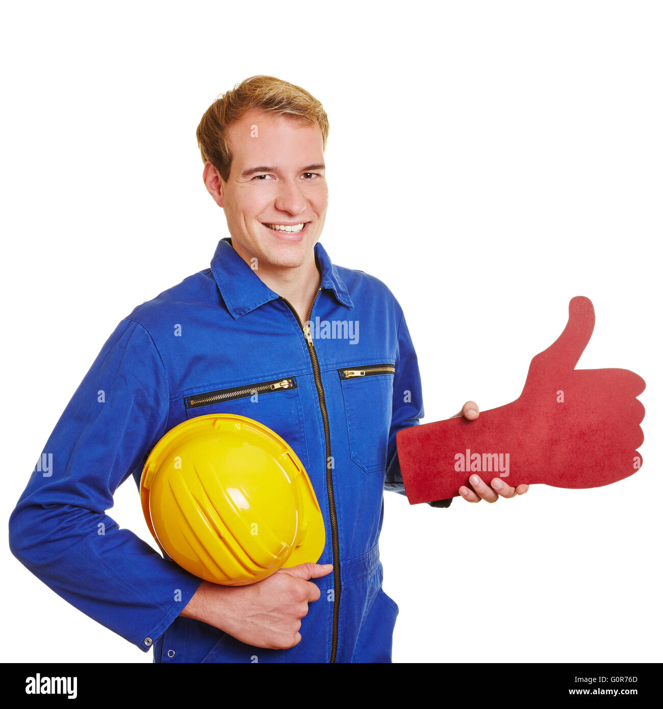 Professionnels construction worker holding un thumb up rouge Banque D'Images