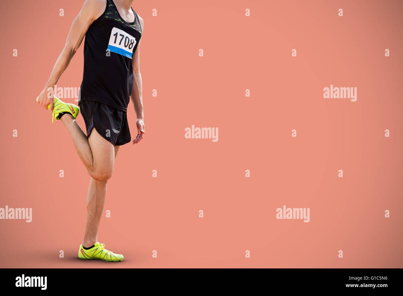 Image composite de l'homme sportif étend sa jambe Banque D'Images