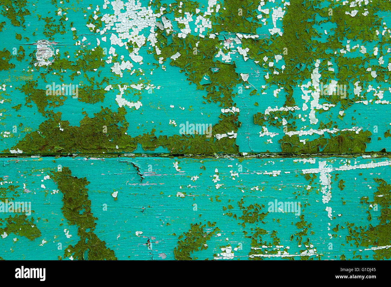 Texture bois avec peinture la couleur est arrachée. L'écaillage de la peinture verte - texture de fond en bois. Banque D'Images