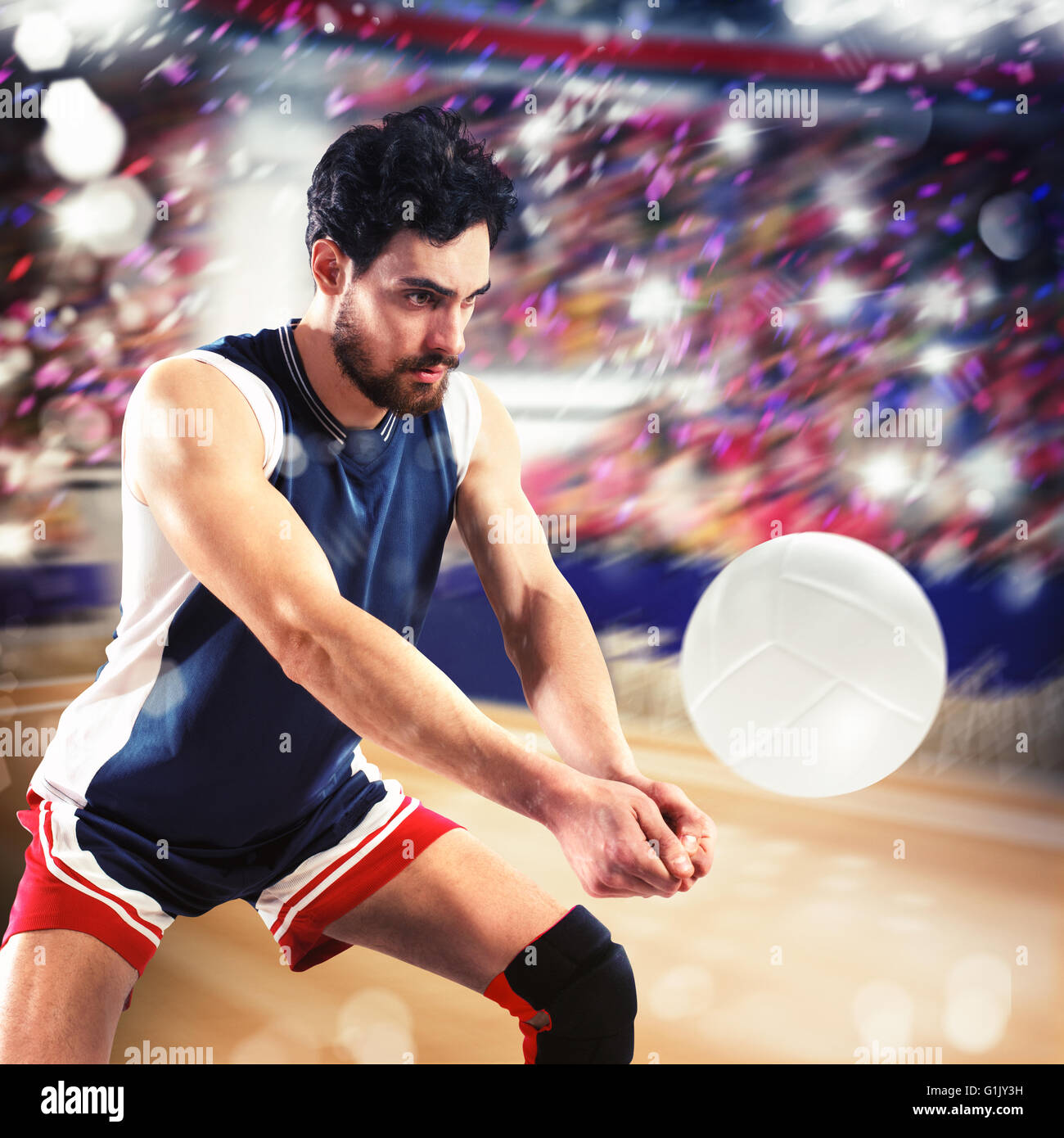 Le joueur frappe le ballon de volley-ball Banque D'Images