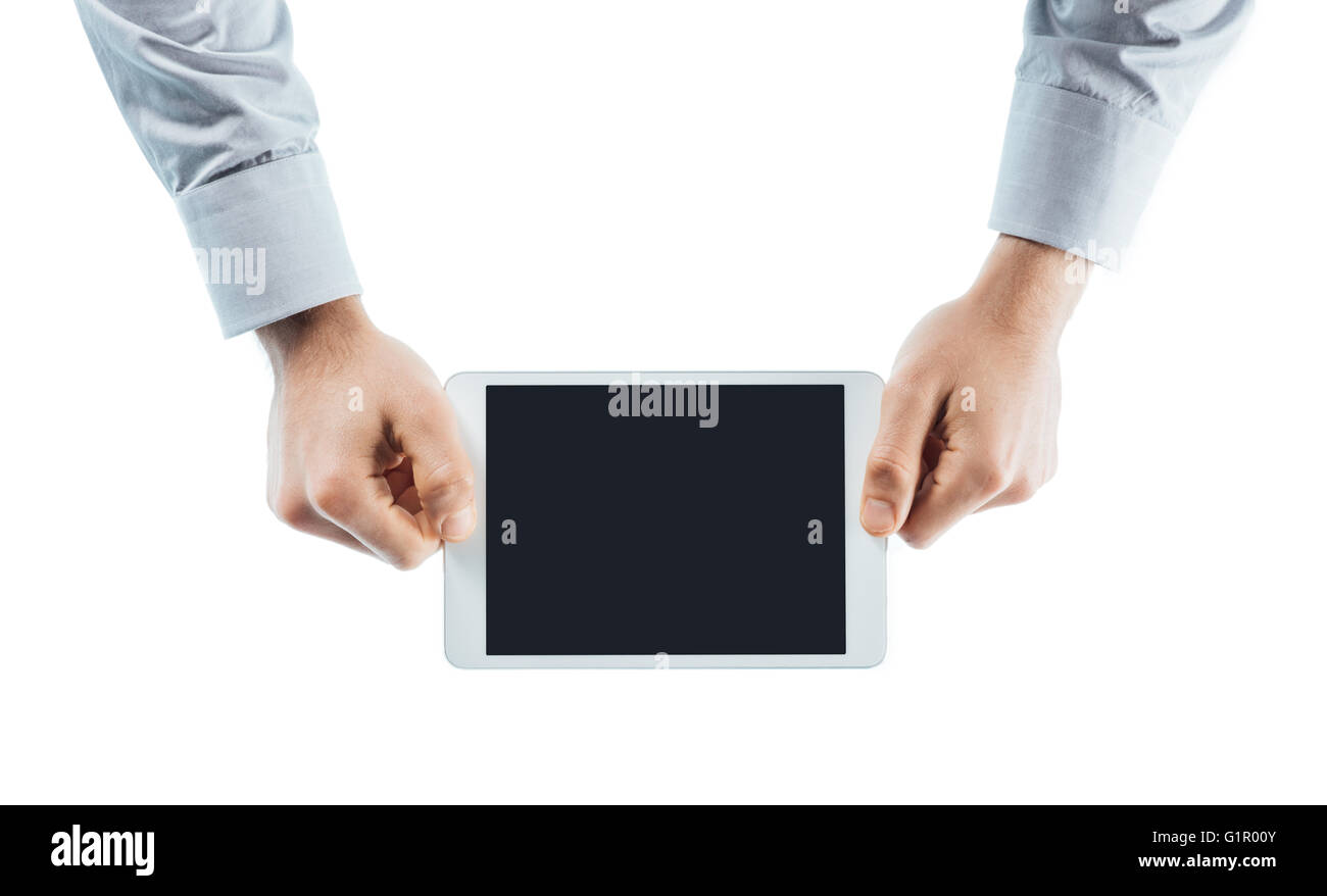 Businessman using a digital tablet mains close up avec copie espace, personne méconnaissable Banque D'Images